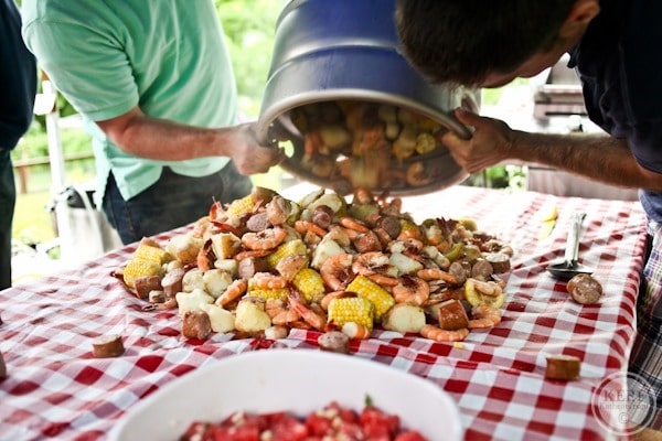 giant beer pot dumping out low country boil ingredients