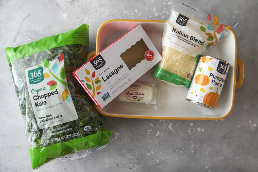 ingredients for kale lasagna - bag of chopped kale, no boil noodles, goat cheese, italian blend and canned pumpkin