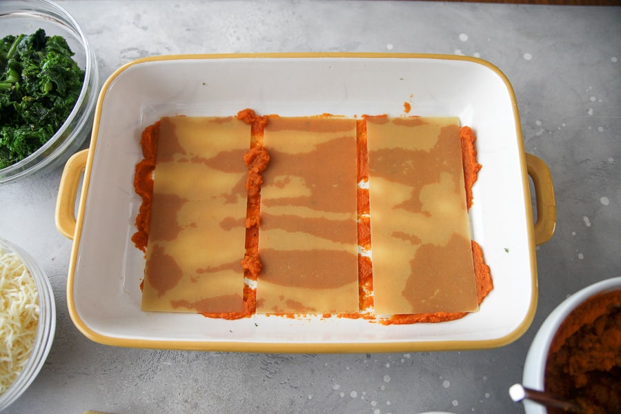 pumpkin and no boil noodles in a yellow casserole dish