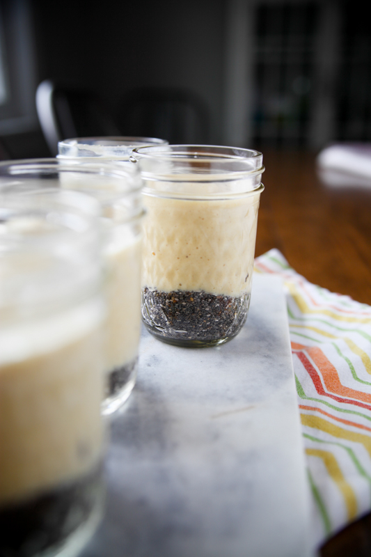 chia seeds in the bottom of a jar with smoothie on top