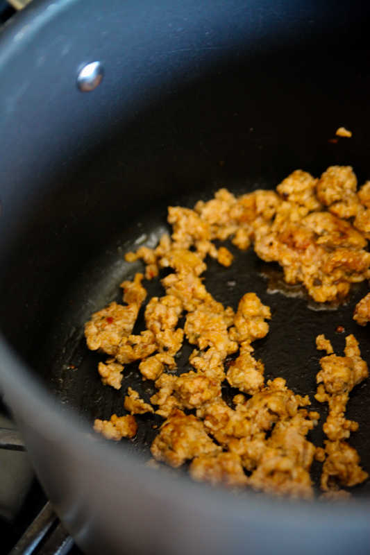 sausage browning in a pot