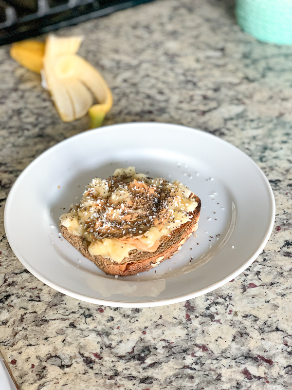 banana smash toast on white plate