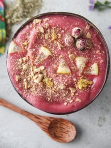 raspberry lemon yerba smoothie in a coconut bowl
