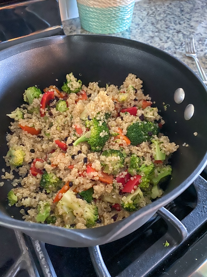 quinoa and veggies cooking in a pot