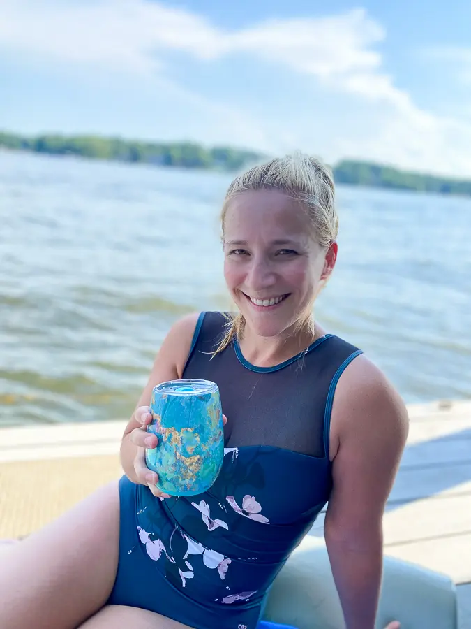 drinking wine on a dock drinking wine on a dock | The Math Behind Vacation Weight Gain