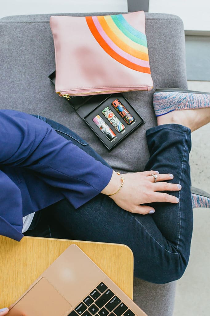 lipstick and makeup bag with computer