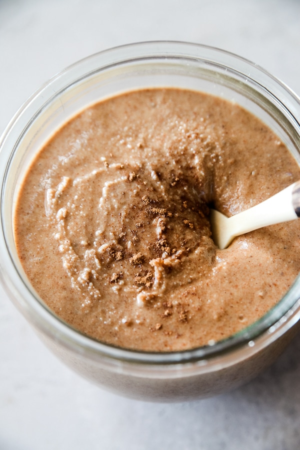 pumpkin spice almond butter in a jar with pumpkin spice on top