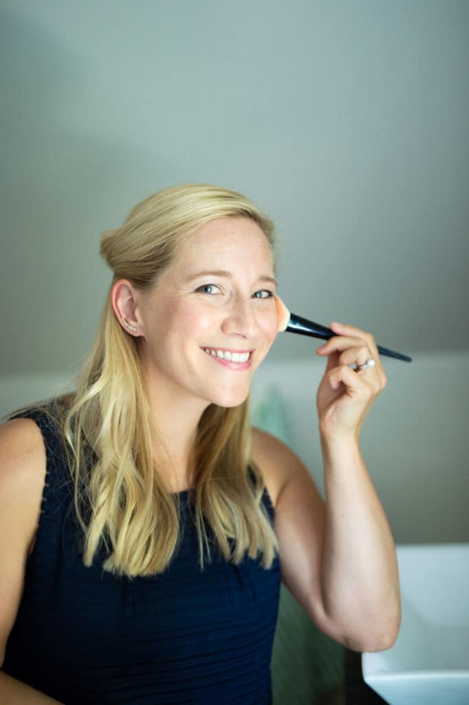 kath putting on beautycounter blush