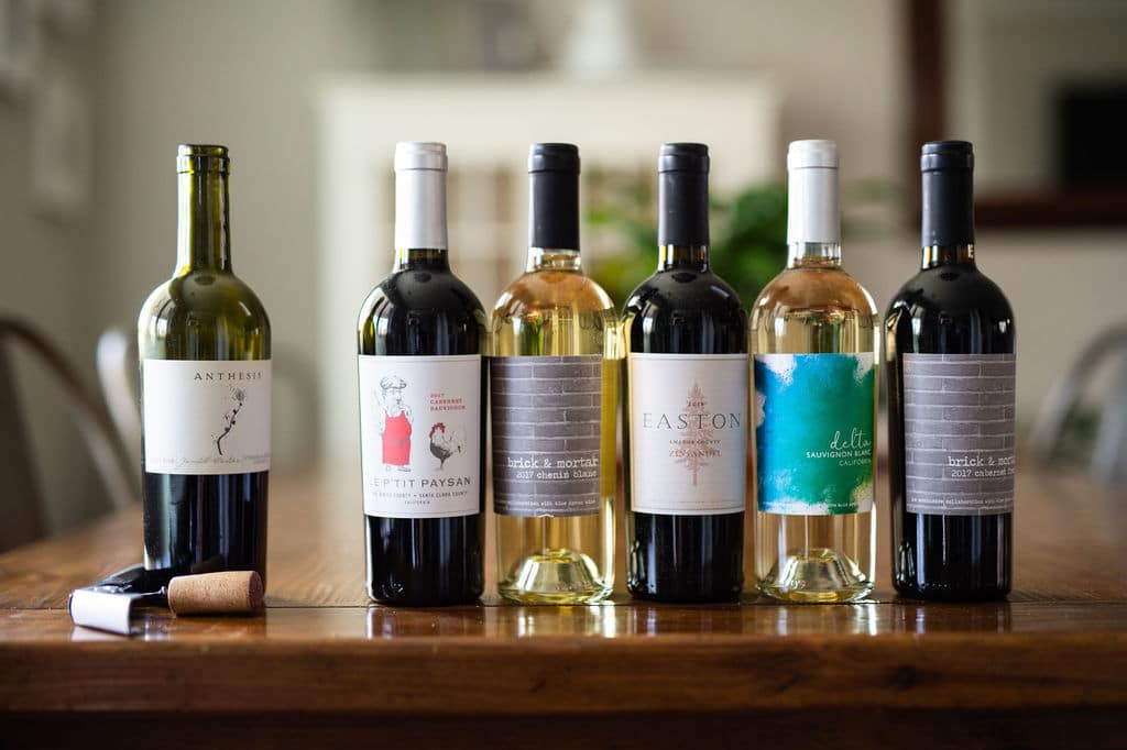 6 bottles of blue apron wine on a dining table