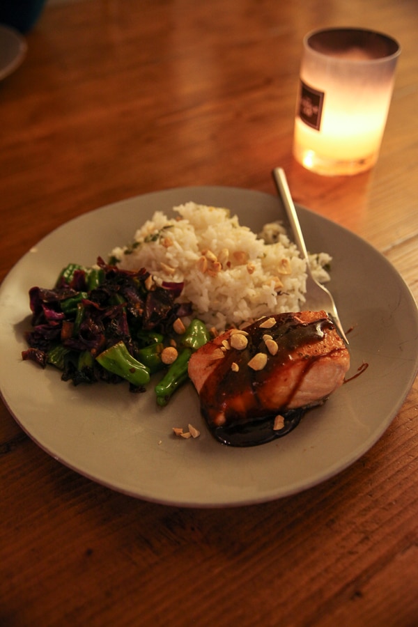 salmon with sauce and rice by candlelight