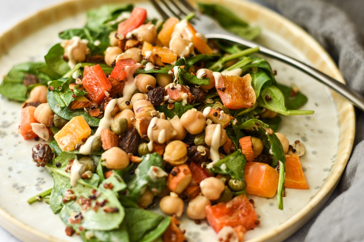 moroccan salad with quinoa on a plate close up with fork