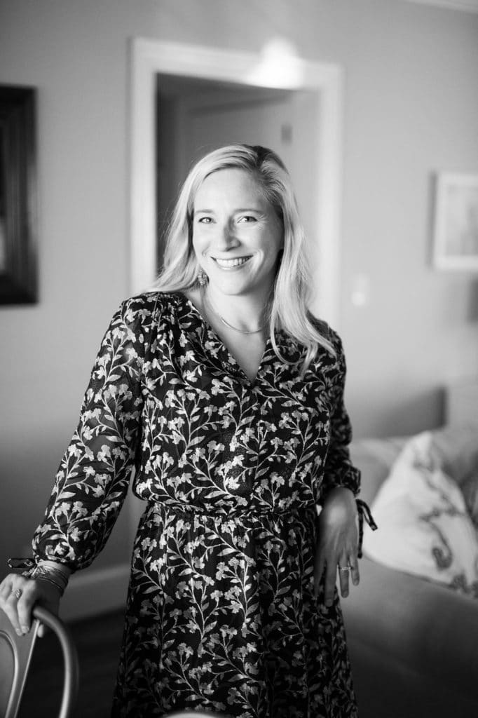kath standing in a dress in black and white