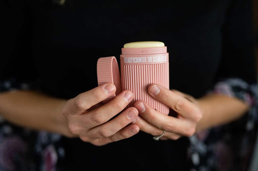 two hands holding clean deo