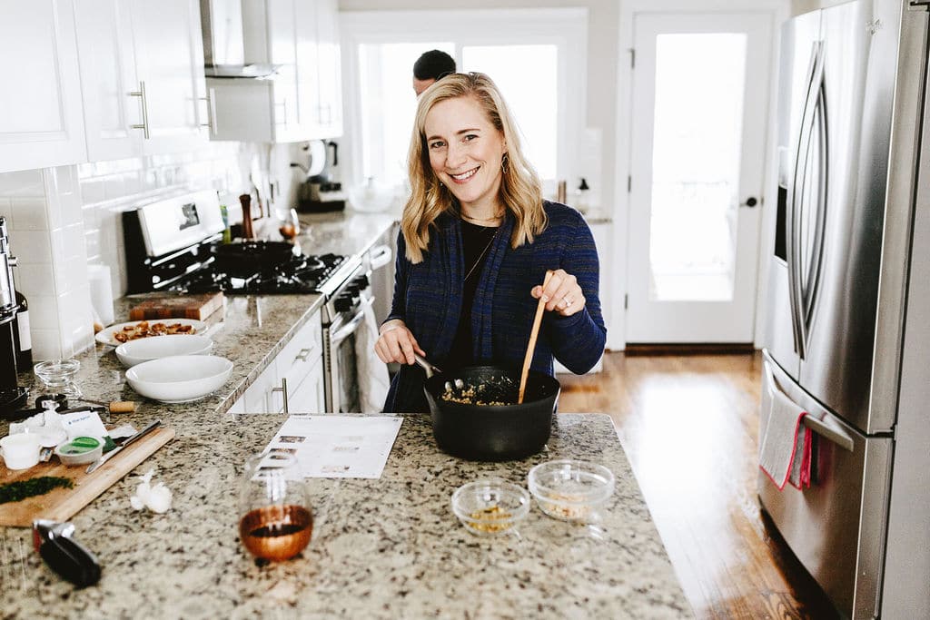 Kath eats cooking in the kitchen