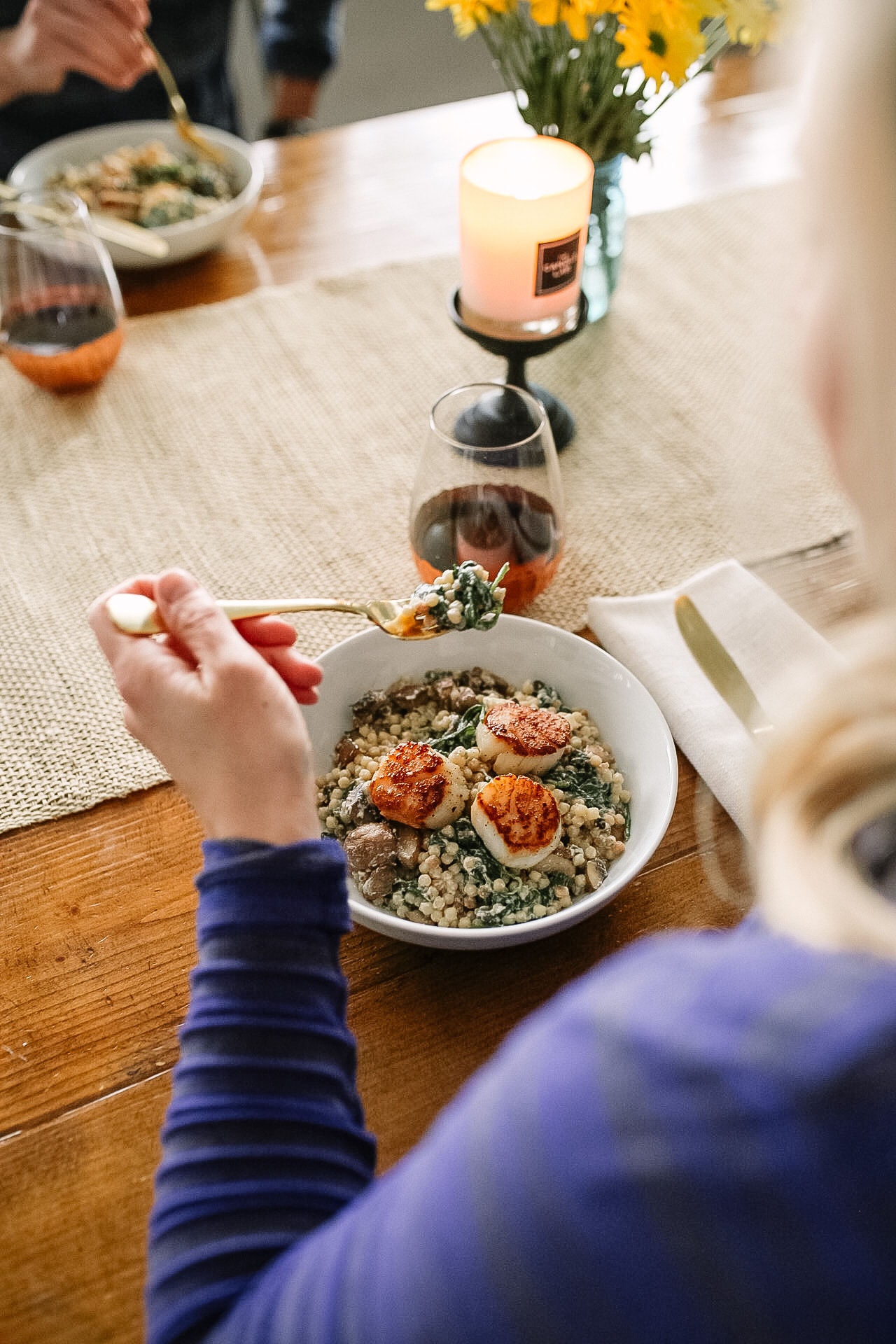 Blue Apron Scallops in a bowl being eaten with a fork