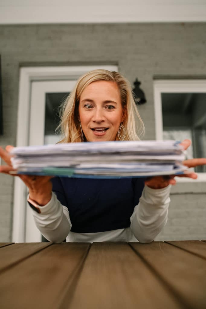 crazy eyes over a stack of paper