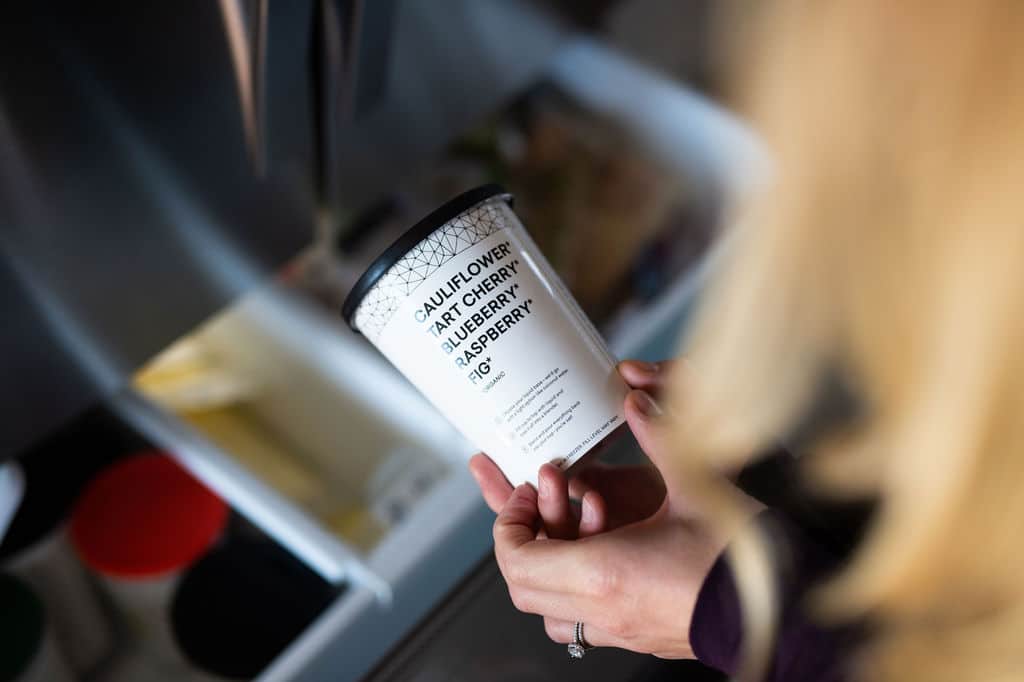 a daily harvest smoothie coming out of a freezer