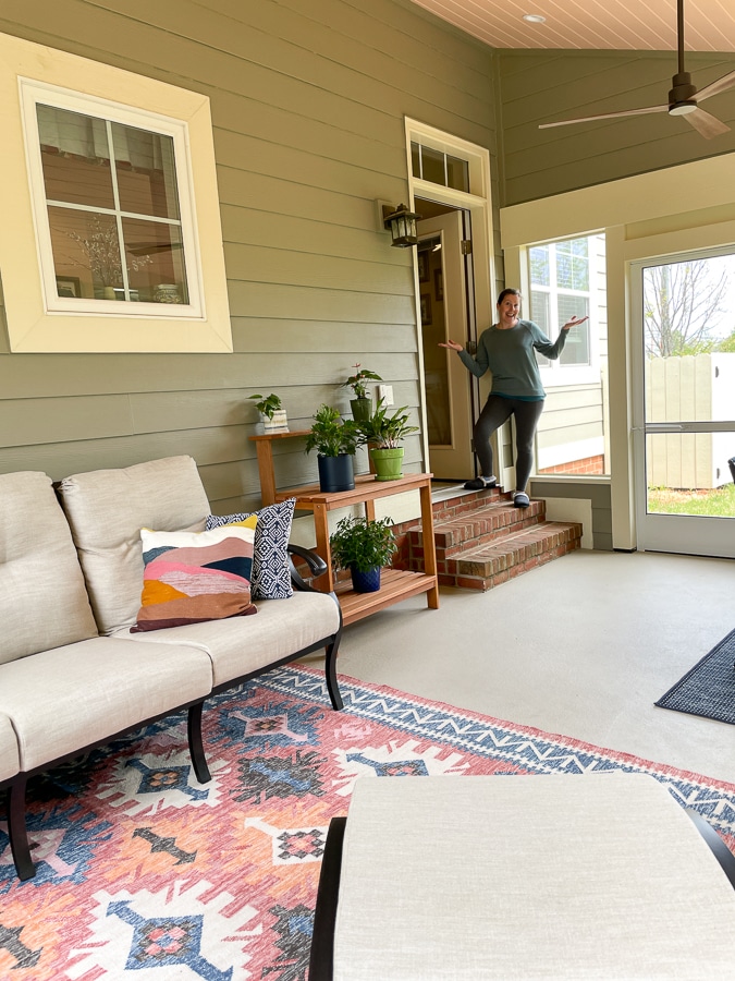 cozy screened in porch with greens and coral