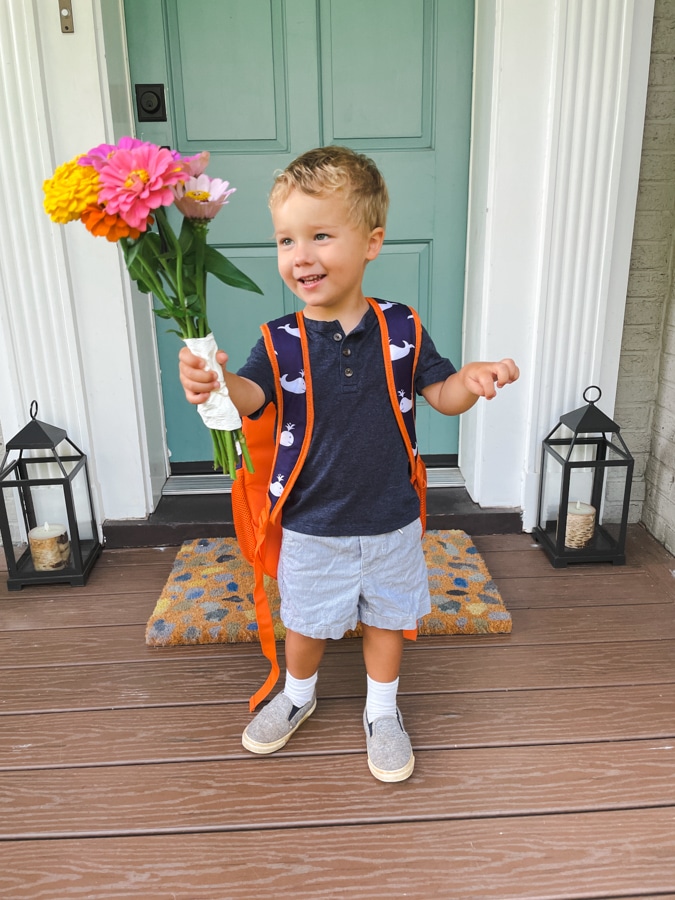 Boy holding floor on first day of school