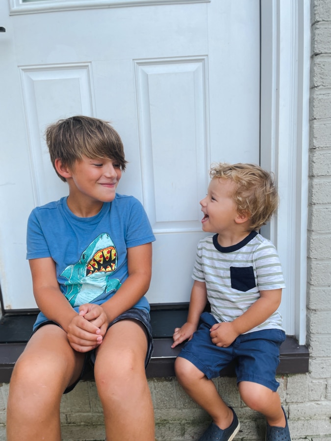 boy in shark shirt and boy in striped t shirt