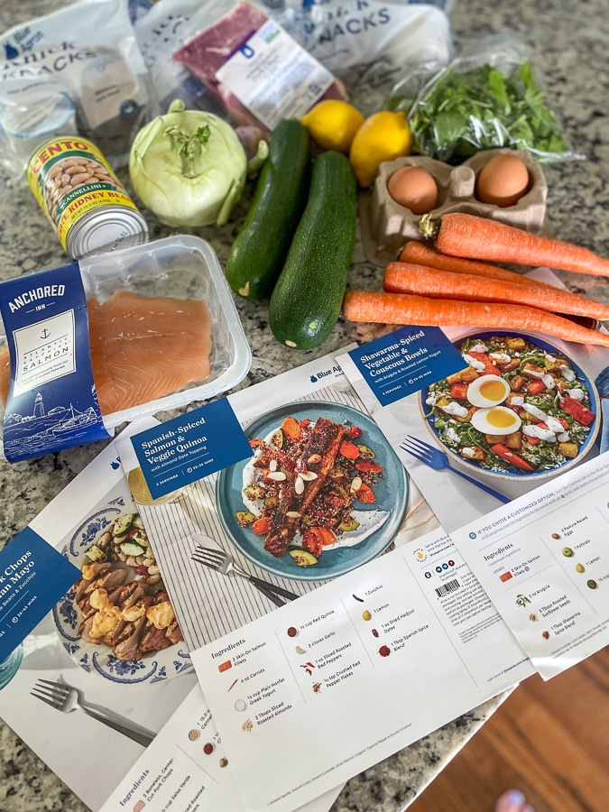 wellness by blue apron recipes and ingredients laid out on a countertop