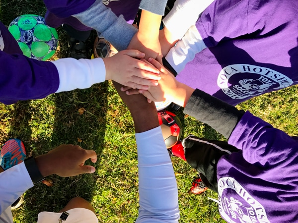fall sports hands in the middle