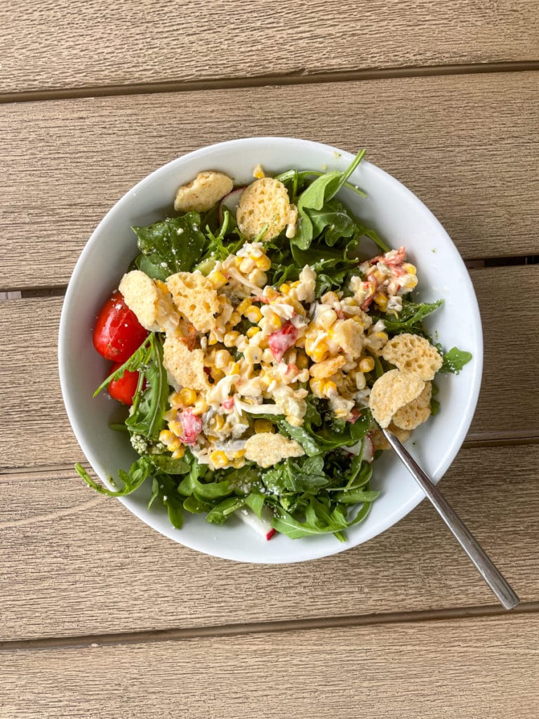 Salad with all kinds of leftovers on top Salad with all kinds of leftovers on top.