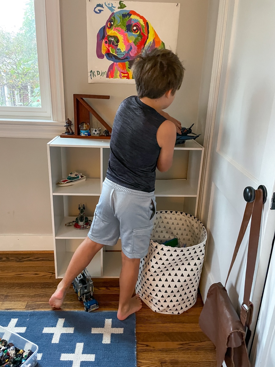 kid organizing shelf - Whats New in Food + Life