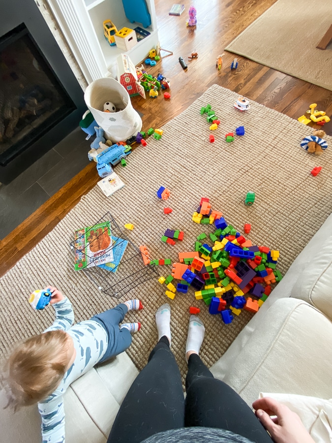 toddler in a room of toys toddler in a room of toys