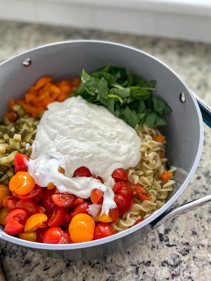 Pour dressing over pasta salad Pour dressing over pasta salad