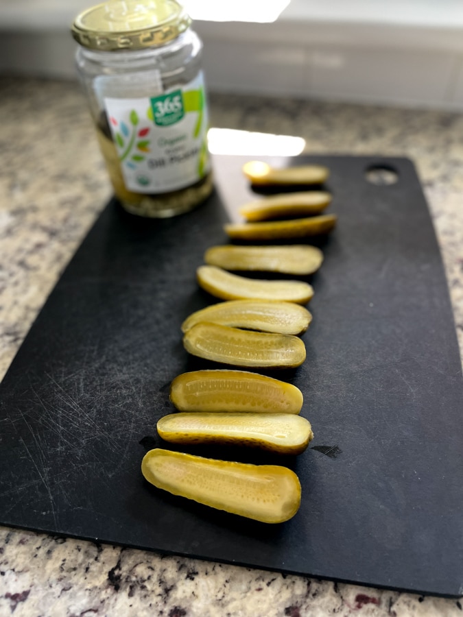 a line of sliced pickles a line of sliced pickles