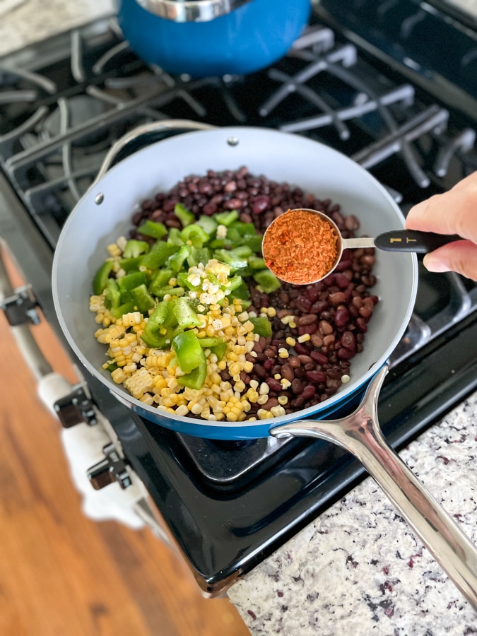 Sauté beans and veggies in pan Sauté beans and veggies in pan