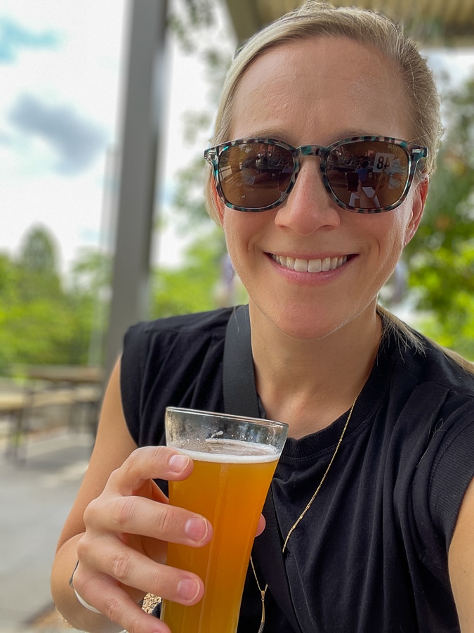 Kath holding beer