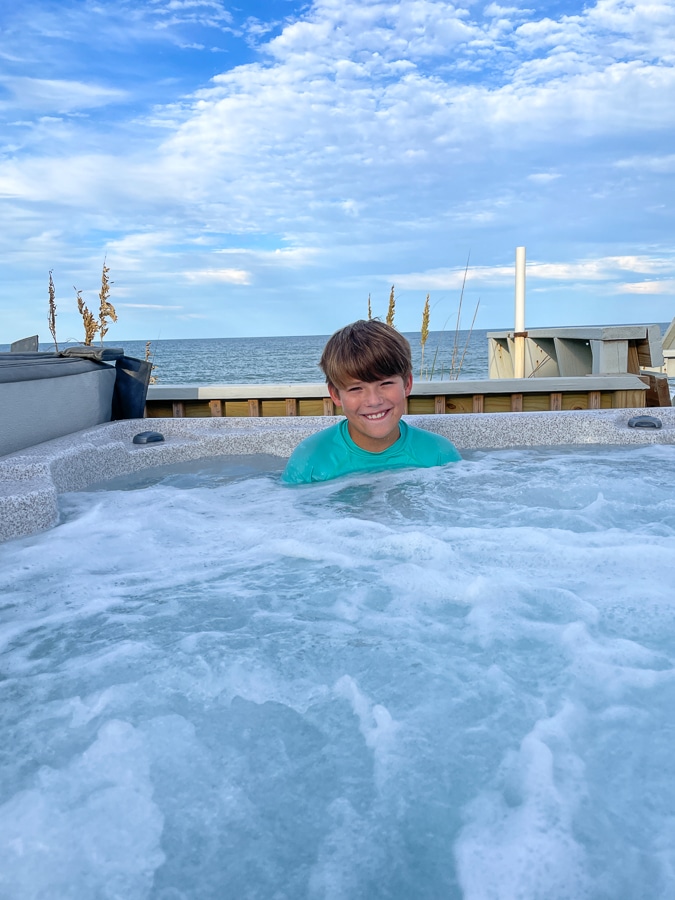 boy soaking in hot tub boy soaking in hot tub