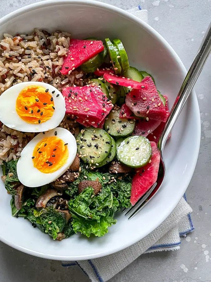 Best Light Dinner Ideas Grain bowl with soft boiled egg, radish, cucumbers