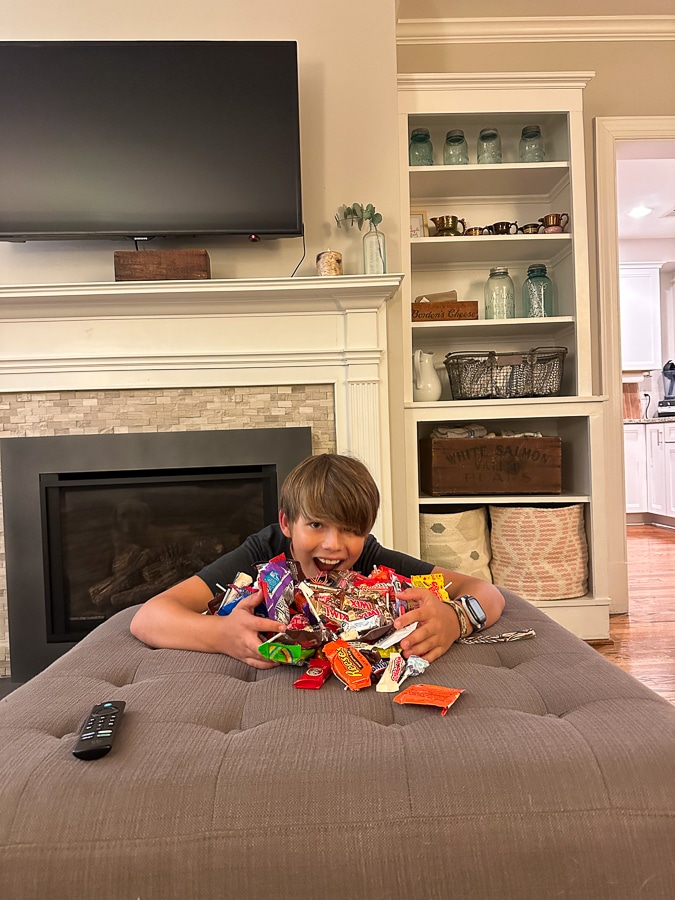 boy with candies boy with pile of candy from trick or treating