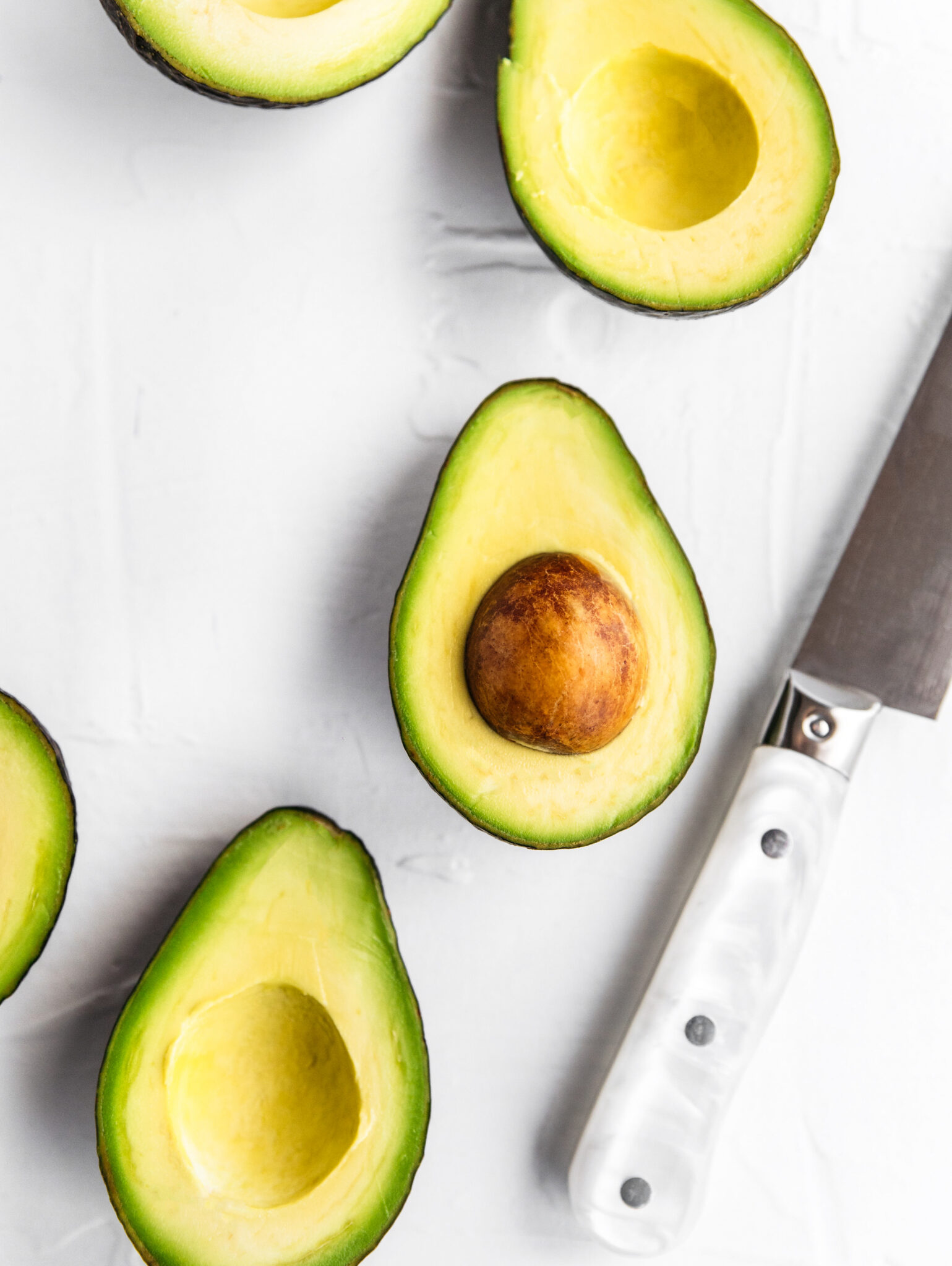 half avocados How To Stay Full Longer | avocados sliced in half