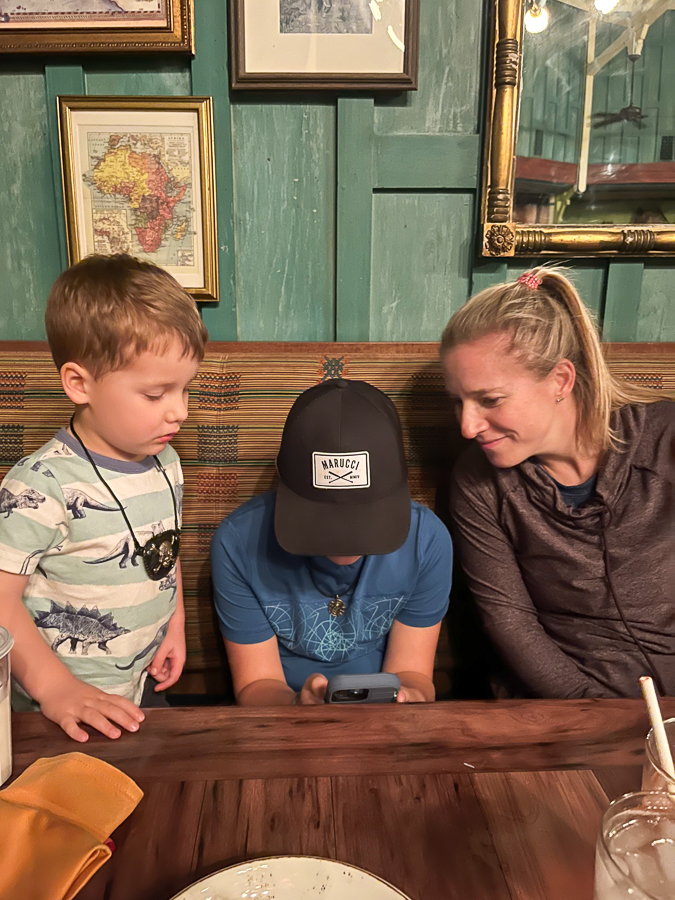family in Disney World Showing Birch the Pirates of the Caribbean videos