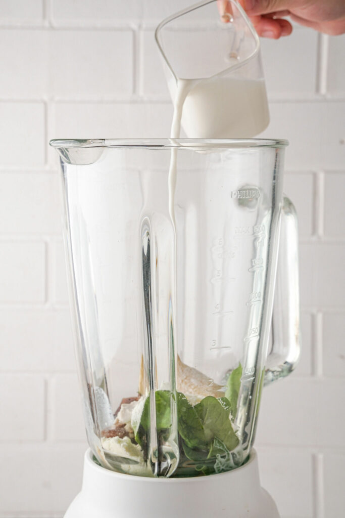 pouring milk in blender pouring milk in blender