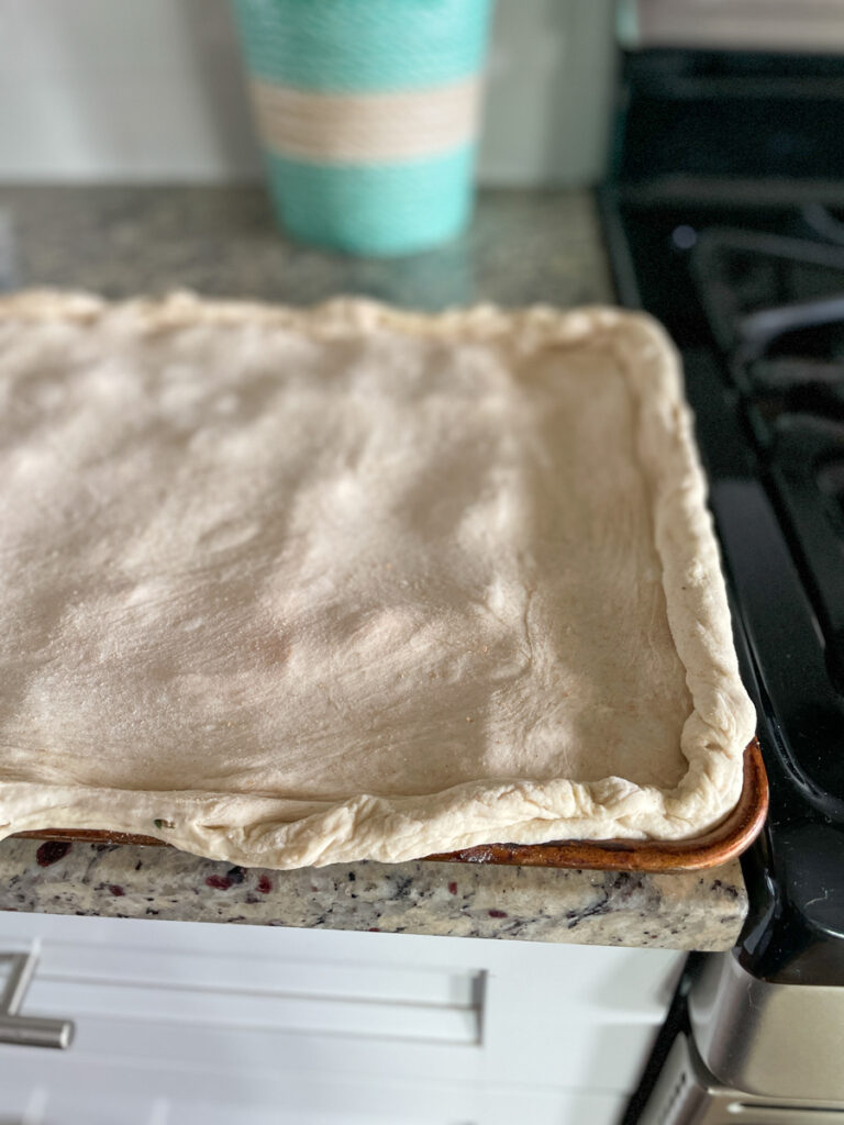 Roll out second dough and add on top