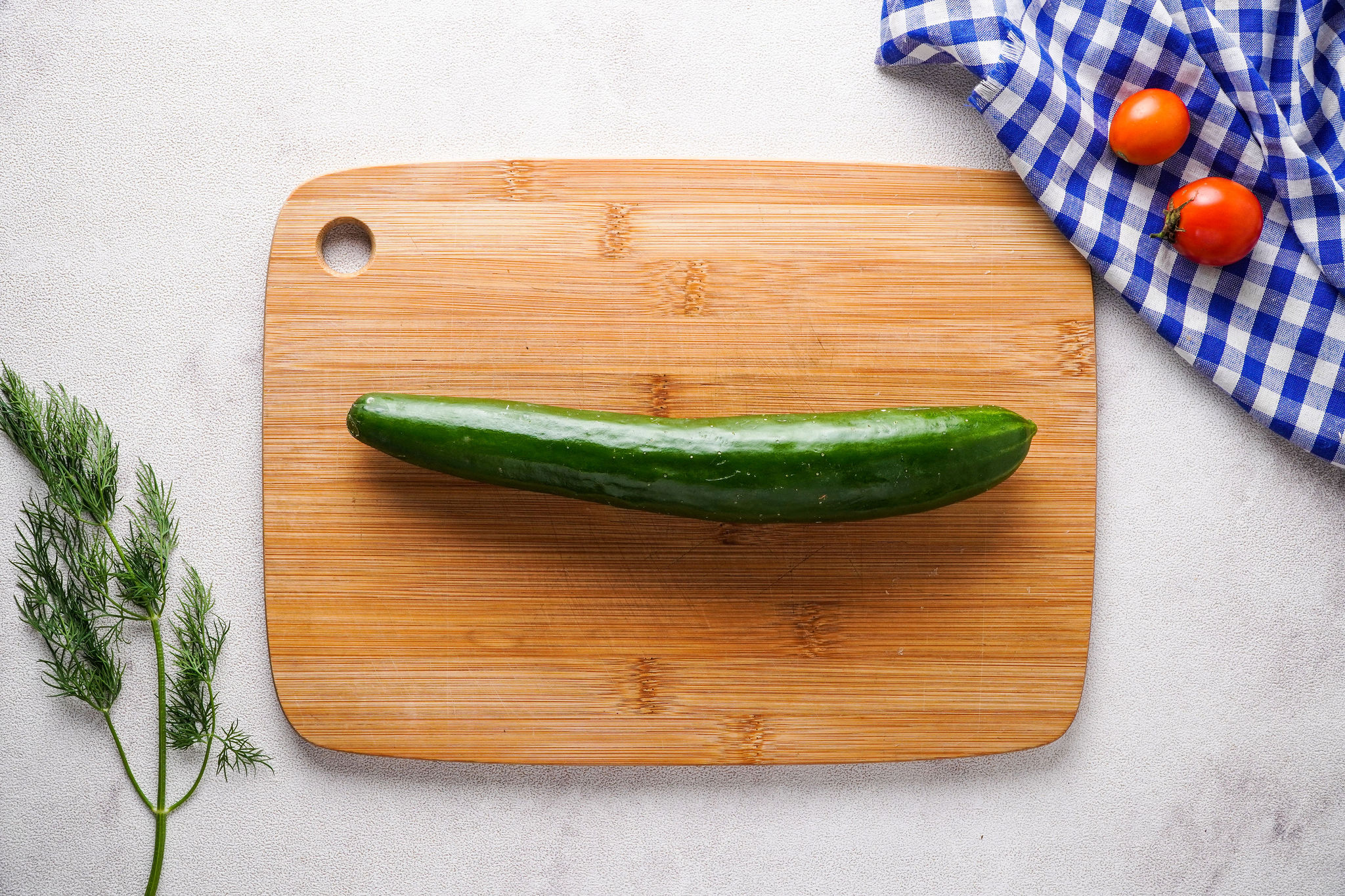 cucumber on chopping board