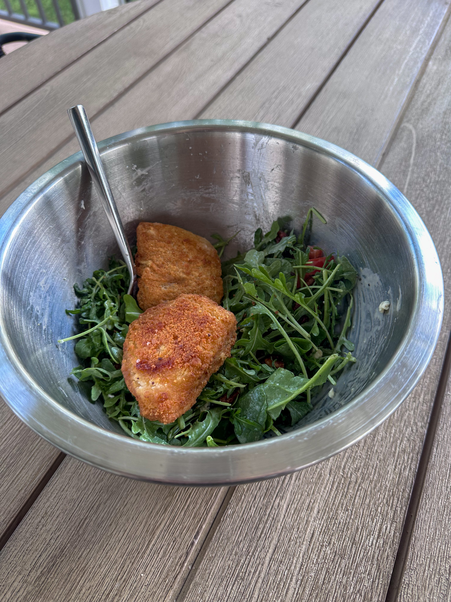 Frozen cod over a salad