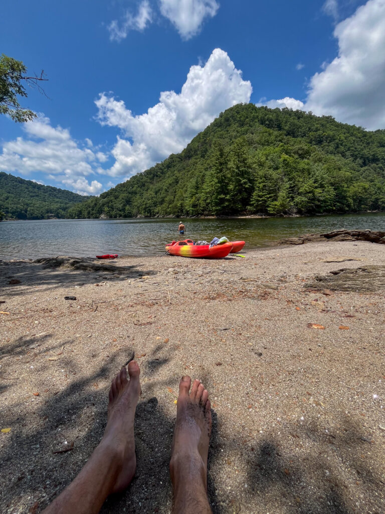 Kath Eats Blogger Kath Younger shares their Bear Lake Reserve vacation: in photo: feet on the sand with a view of the lake Kath Eats Blogger Kath Younger shares their Bear Lake Reserve vacation: in photo: feet on the sand with a view of the lake