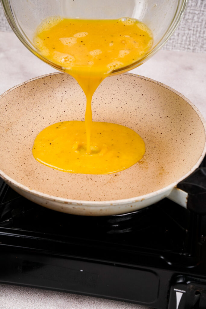 Pour the eggs into skillet