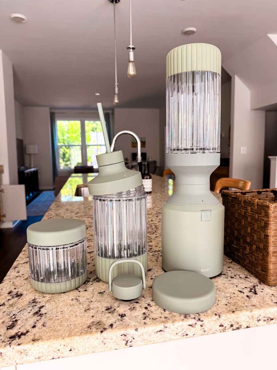beast blender mega 1200 on a countertop with all the parts around it